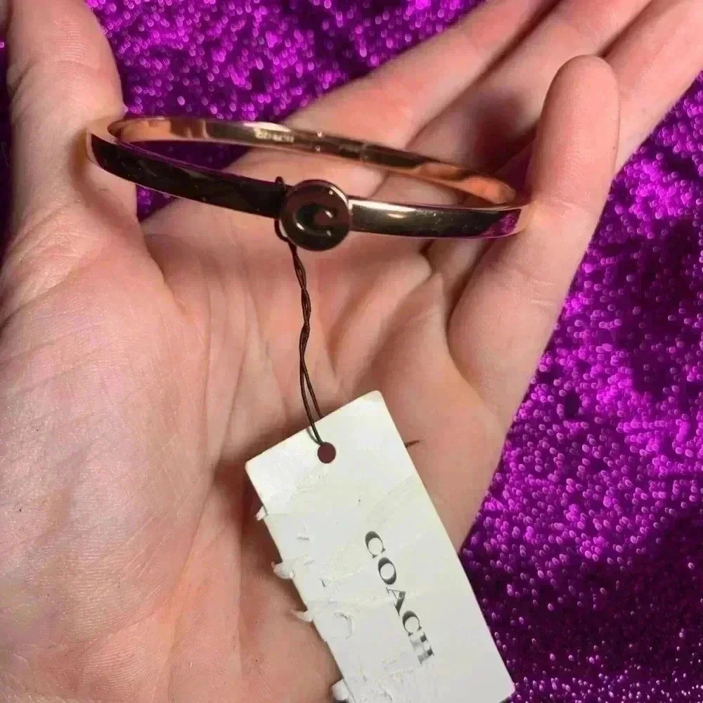 Genuine coach bracelet in gold